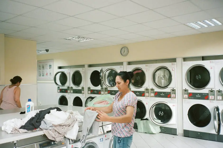 A person inspecting a washing machine for leaks